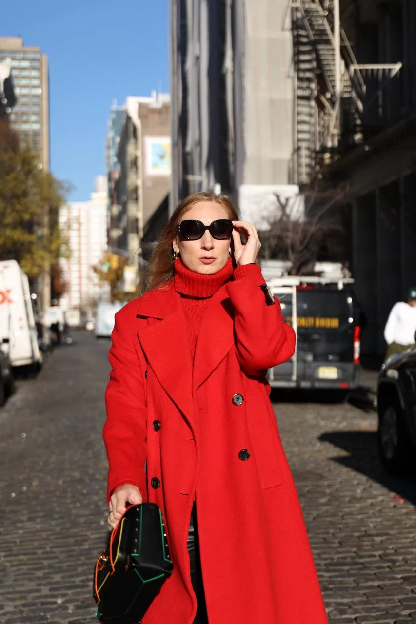 Anastasia Kartashova in a red coat on a New York street